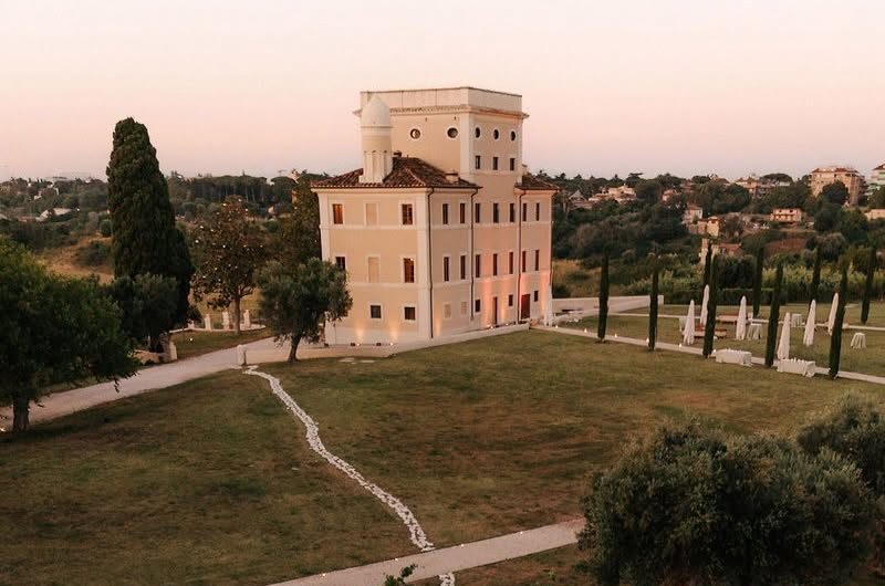 Outdoor wedding reception at Tenuta Villa York, Rome — aerial view of dinner tables and dance floor at golden hour